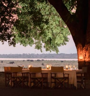 Outdoor dining at Wilderness Little Ruckomechi camp, Zimbabwe