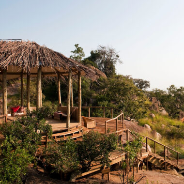 Outdoor seating area at the Lamai Serengeti lodge, overlooking African landscape