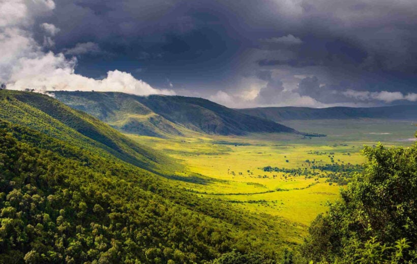 Clouds rolling in over the verdant hills of the Ngorongoro Crater, Tanzania.