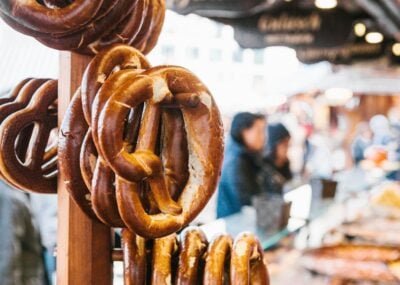 Traditional pretzels called Brezel hang on the stand