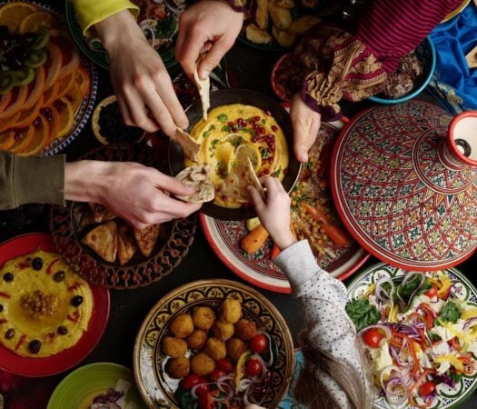 A family sharing a meal of typical Middle Eastern cuisine