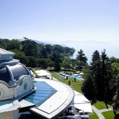 Aerial view of Beau-Rivage Palace, Switzerland showing gardens and the lake