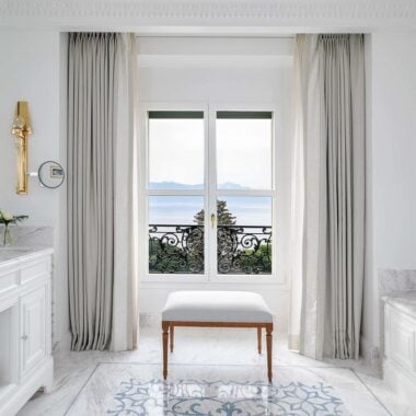 A white marble bathroom in Beau-Rivage Palace, Switzerland