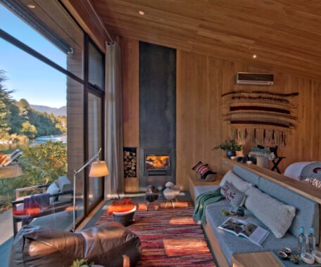 A lounge with a fireplace at &Beyond Vira Vira in Chile