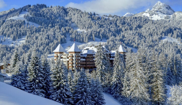 A view of the Alpina and surrounding forests covered in now, Gstaad, Switzerland