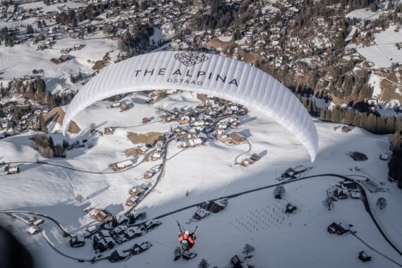 Paragliding over the town at The Alpina in Gstaad, Switzerland