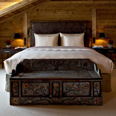 A double bed at The Alpina in Gstaad, Switzerland