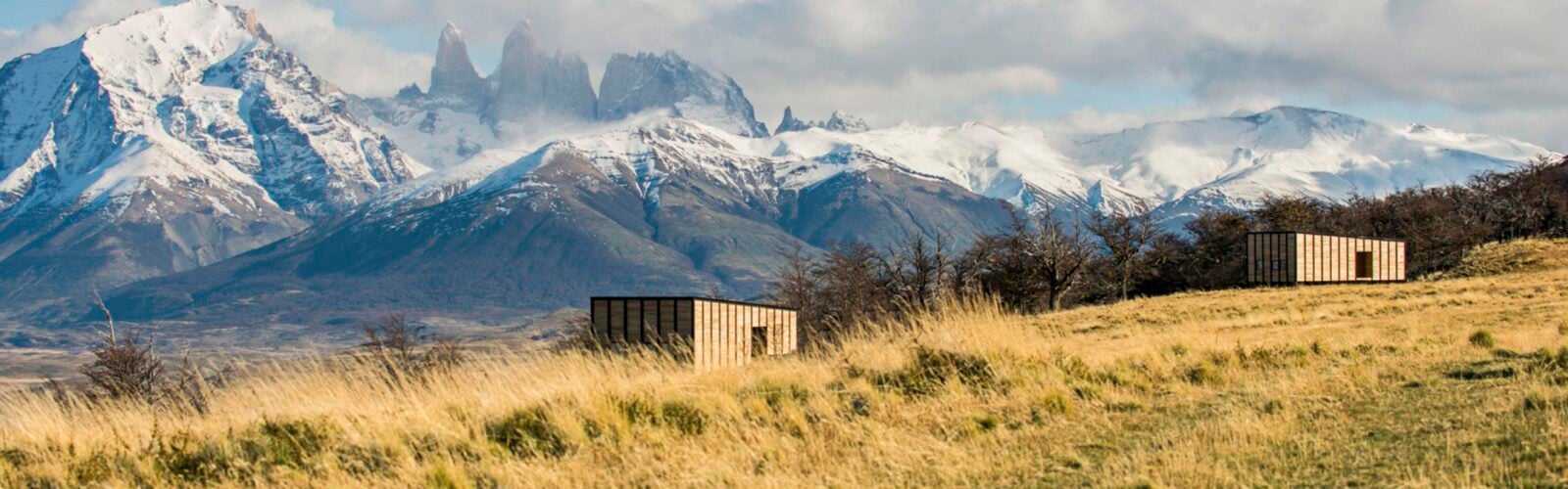 View of private villas with Torres del Paine in the background at Awasi Patagonia