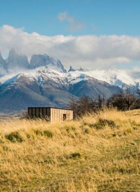 View of private villas with Torres del Paine in the background at Awasi Patagonia