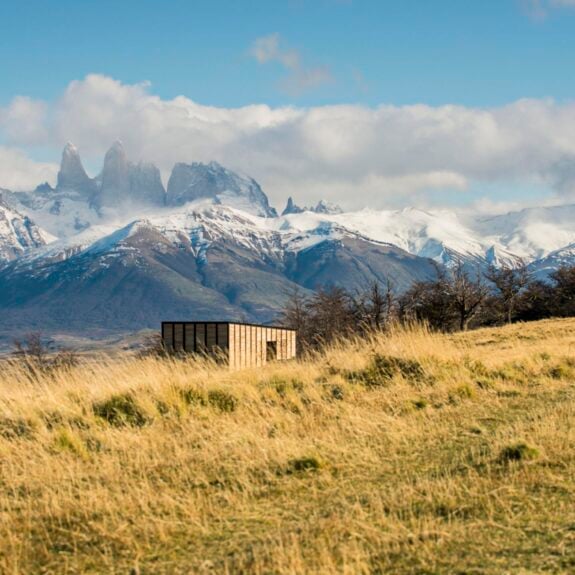 View of private villas with Torres del Paine in the background at Awasi Patagonia