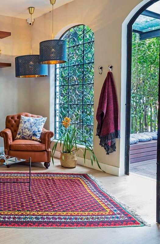 A sitting room leading to garden at Casa Legado in Bogotá, Colombia