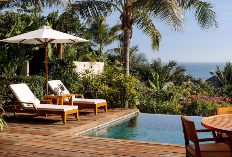 Sun loungers by the pool at Nihi Sumba, Indonesia