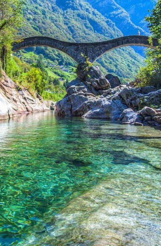 A footbridge over a river in Ticino, Switzerland