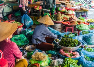 Women selling food on the street in Vietnam