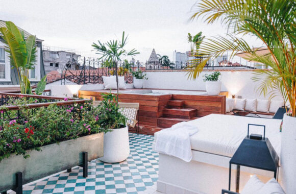 Rooftop hotel terrace with hot tub and seating