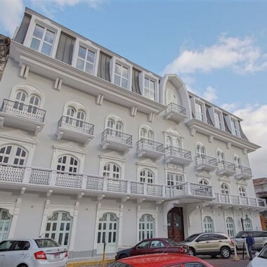 Exterior of grand hotel with balconies and large windows