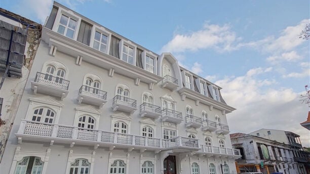 Exterior of grand hotel with balconies and large windows