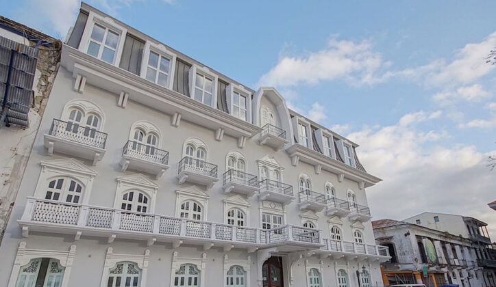 Exterior of grand hotel with balconies and large windows