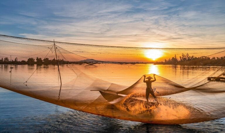 Fishing at sunrise in Vietnam