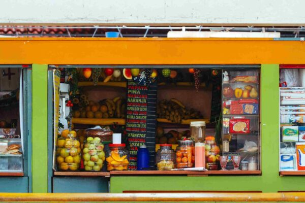 Juice and variety stand in the market of Puno seen from the front Cusco