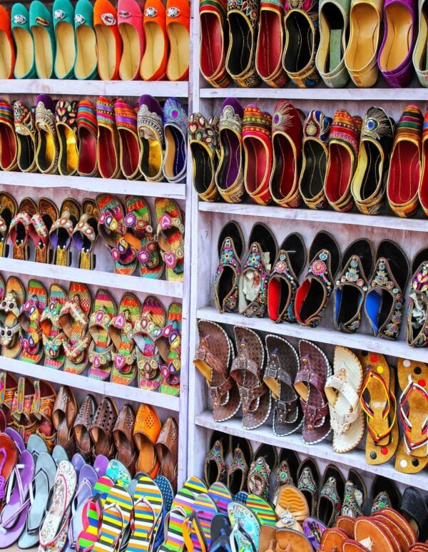 Display of shoes at the street market in Taj Ganj neighborhood of Agra, Uttar Pradesh, India. Agra is one of the most populous cities in Uttar Pradesh