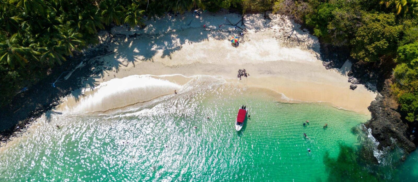 Aerial view of a beach with a small boat in the Gulf of Chiriquí, Panama