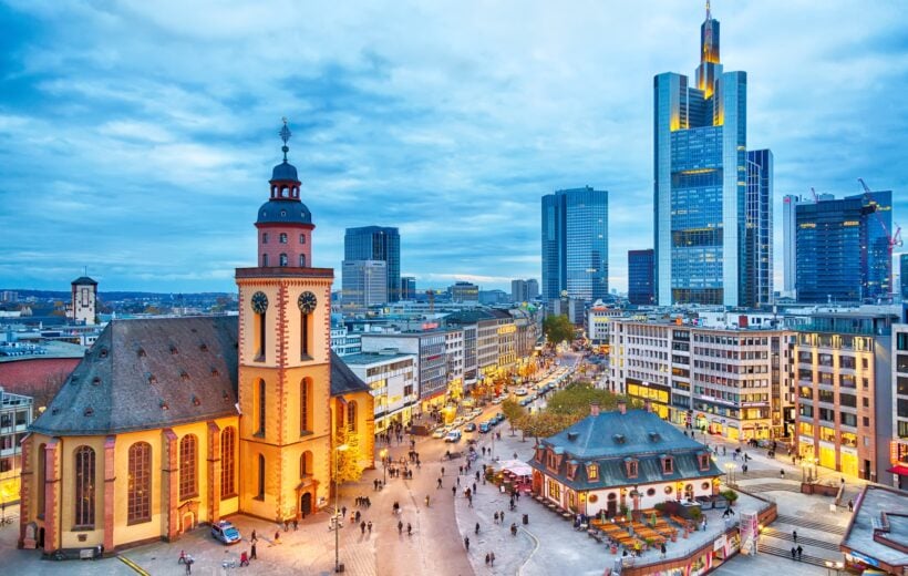 FRANKFURT, GERMANY - NOVEMBER, 2017: View to skyline of Frankfurt in sunset blue hour. St Paul's Church and the Hauptwache Main Guard building at Frankfurt central street Zeil