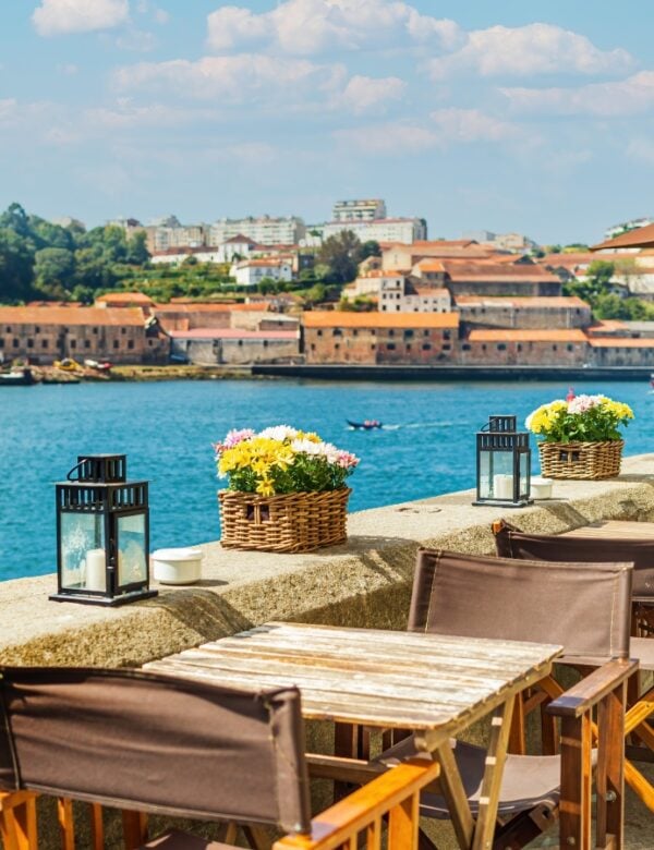 Open-air street cafe on the banks of the River Douro without people