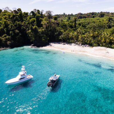 Private beach with boats at Islas Secas private island resort, Panama