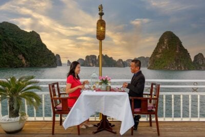 Romantic dinner on deck on The Violet, Halong Bay, Vietnam