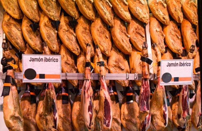 Counter with jamon in market in Madrid, Spain.