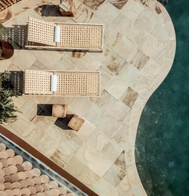 Aerial view of outdoor seating area with private pool an two wooden sun loungers