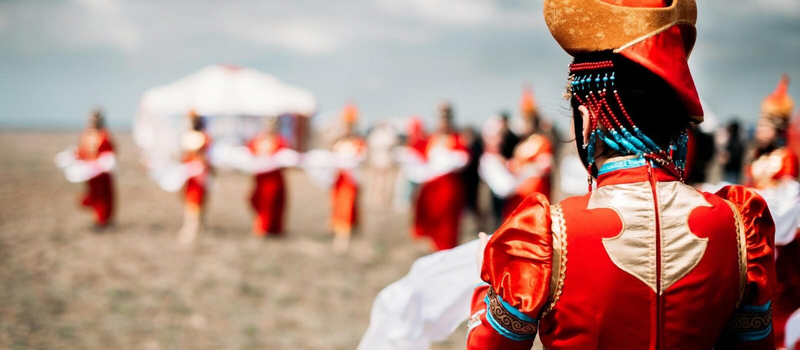 Photo of young beautiful women wearing in traditional national Mongolian Kalmykian dresses in the festival.