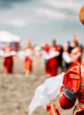 Photo of young beautiful women wearing in traditional national Mongolian Kalmykian dresses in the festival.