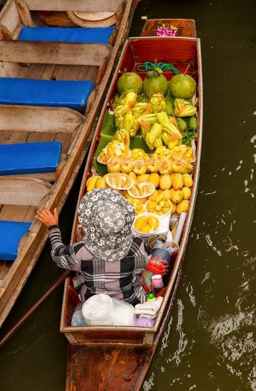 Long-tail boat with fruits on floating market in the Mekong Delta, Vietnam