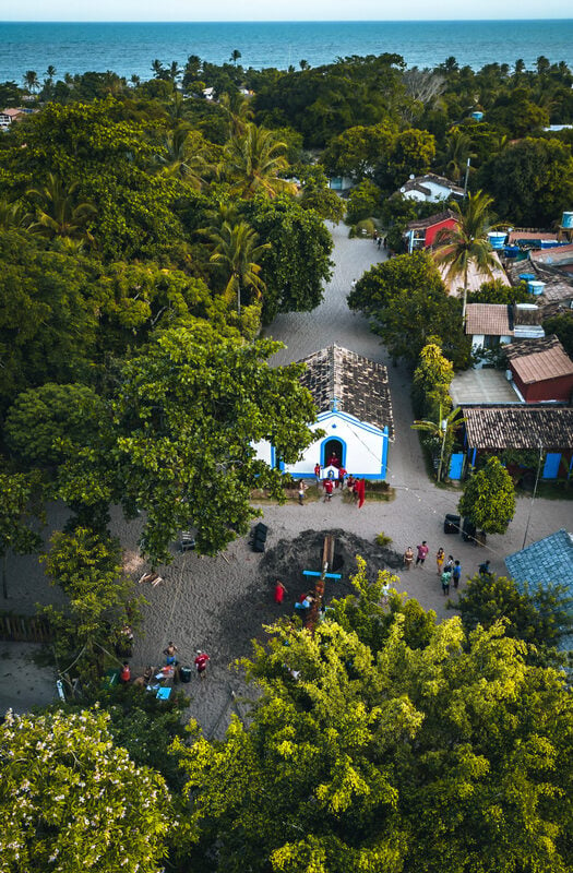 Aerial view of small town of Trancoso in Brazil, with small blue and white building in the center of a village square