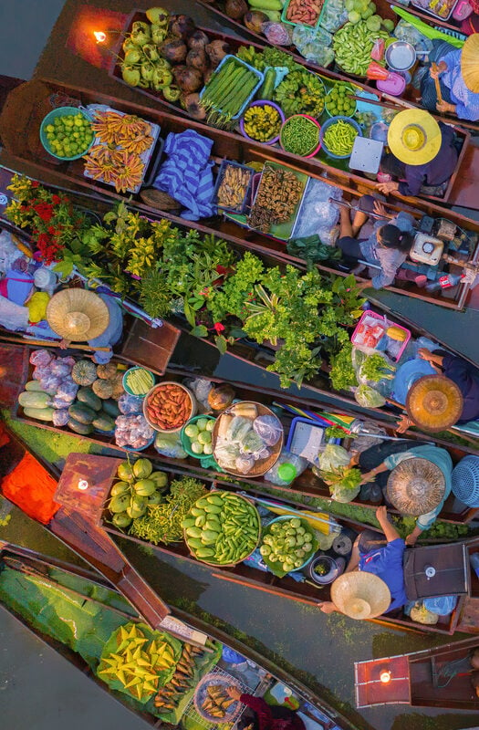 Fresh herbs and vegetables on a floating market in Thailand