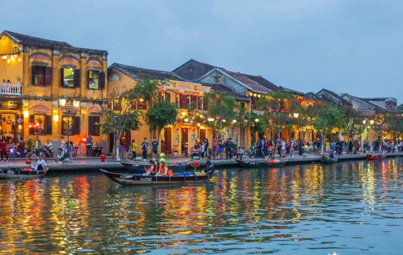 Lights reflecting on the river at dusk in Hoi An, Vietnam