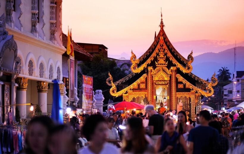 People walking the streets of Chiang Mai, Thailand at dusk