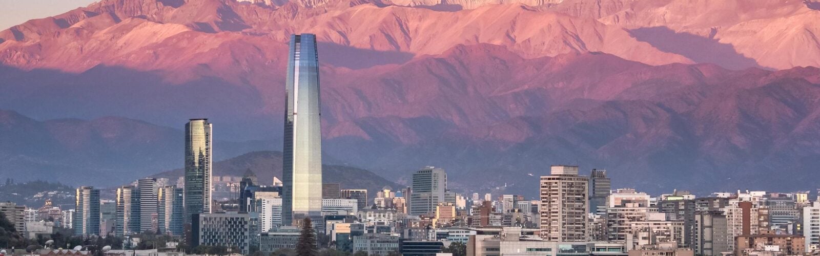 Aerial view of Santiago skyline at sunset with the Andes in the background