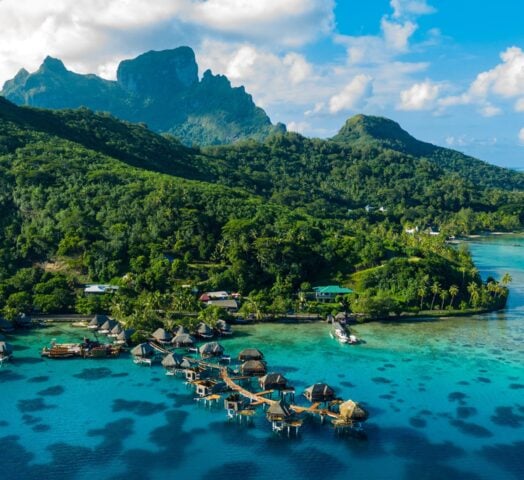 Aerial view of Bora Bora with overwater bungalows over the ocean