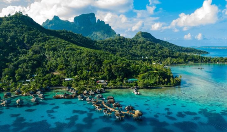 Aerial view of Bora Bora with overwater bungalows over the ocean