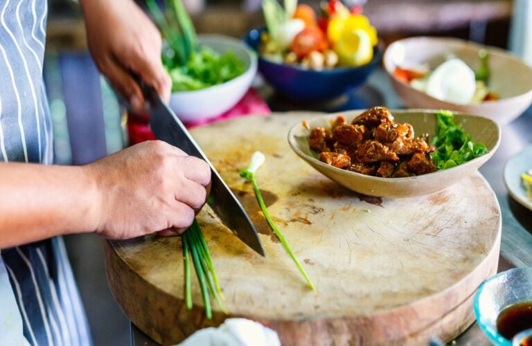 Chef making traditional cambodian meat dish at cooking class