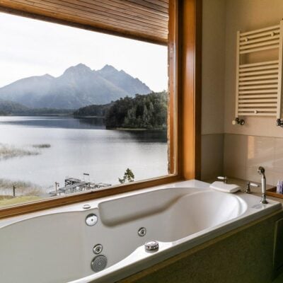 A bathtube with a lake view at Llao Llao Resort, Argentina