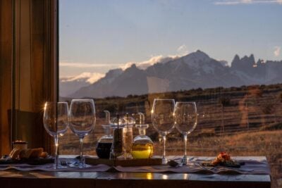 A dining table with mountain views at Estancia Cerro Guido, Chile