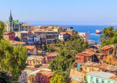 A view of the colourful streets of Valparaiso in Chile, with the ocean in the background