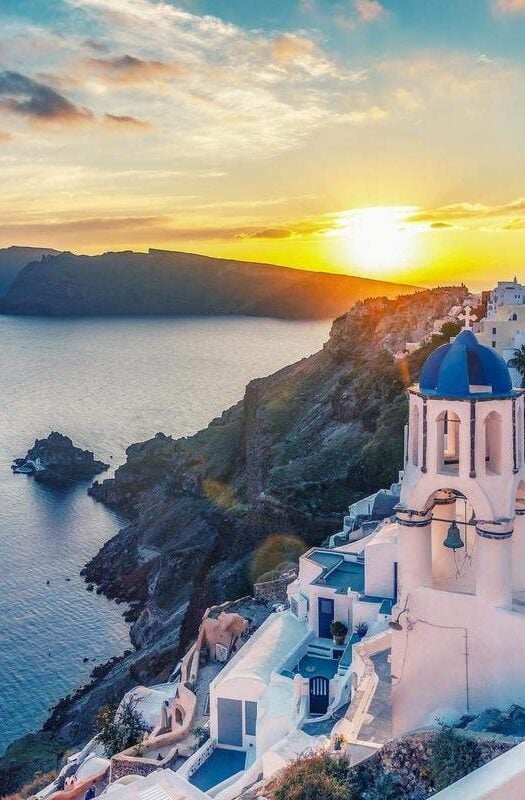 Beautiful view of Churches in Oia village, Santorini, Greece at sunset