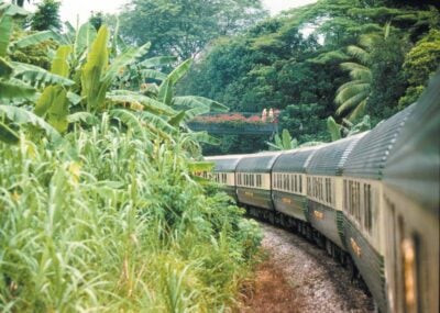 The Belmond Eastern & Oriental Express train travelling through the jungle in Malaysia