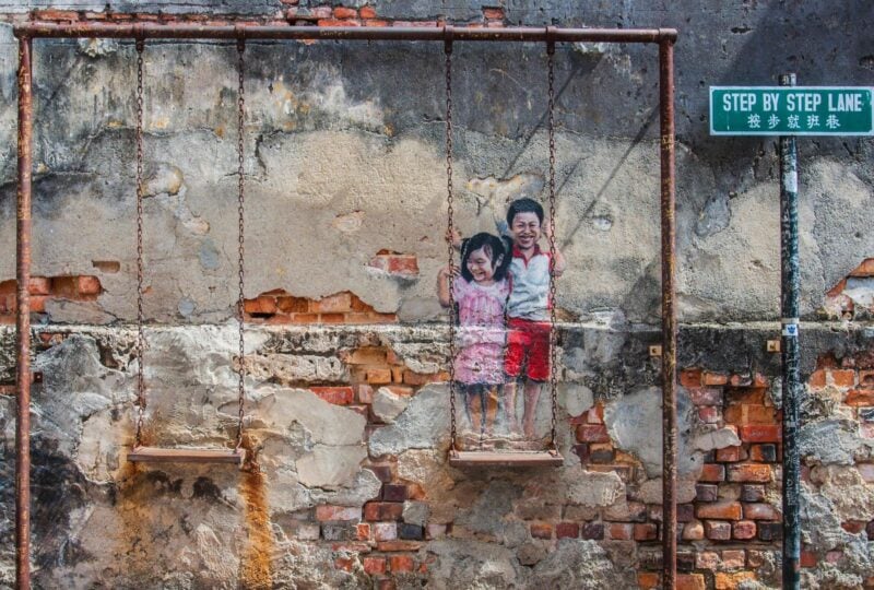 A street art painting of two children in George Town, Penang