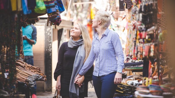 Close up image of a same sex female / lesbian couple enjoying sightseeing in the Cape Town South Africa city Center